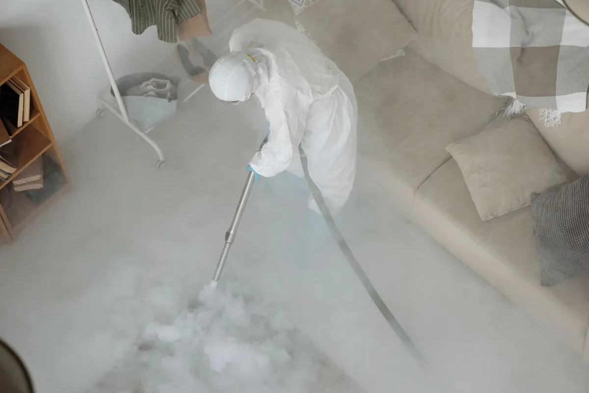 Biohazard cleanup technician in protective equipment, Klamath Falls, OR